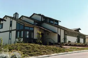 Completed modern multi-level home with wood trim and stone accents by L.E. Baca Construction