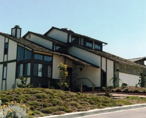 Completed modern multi-level home with wood trim and stone accents by L.E. Baca Construction