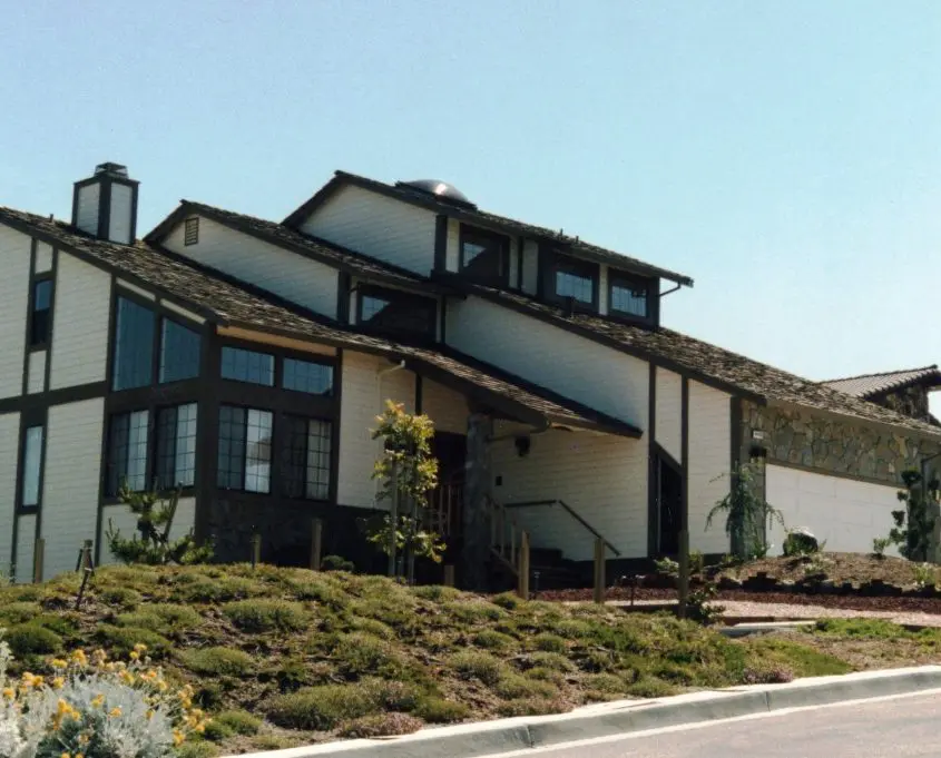 Completed modern multi-level home with wood trim and stone accents by L.E. Baca Construction
