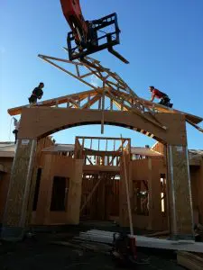 Roofer or builder working on the roof structure at a construction site