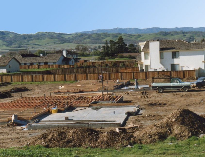 Residential construction site with foundation and framing work by L.E. Baca Construction